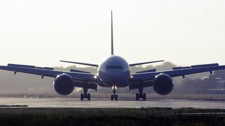 Commercial airplane breaking after landing on the runway