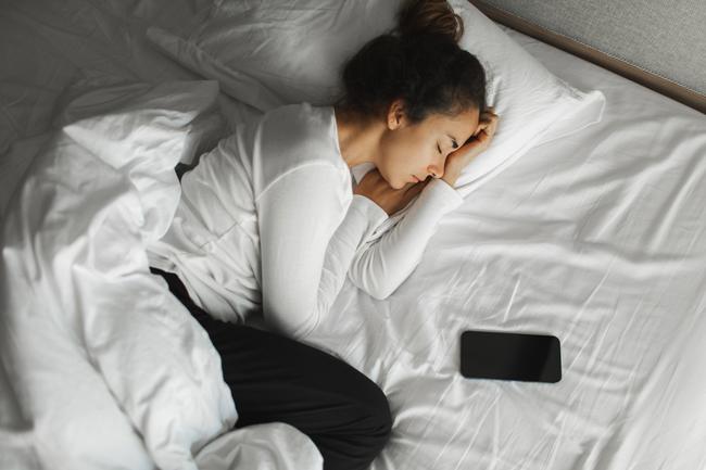 Apple says, ‘Sleeping or sitting on the charging cable or connector should be avoided’, stock image.